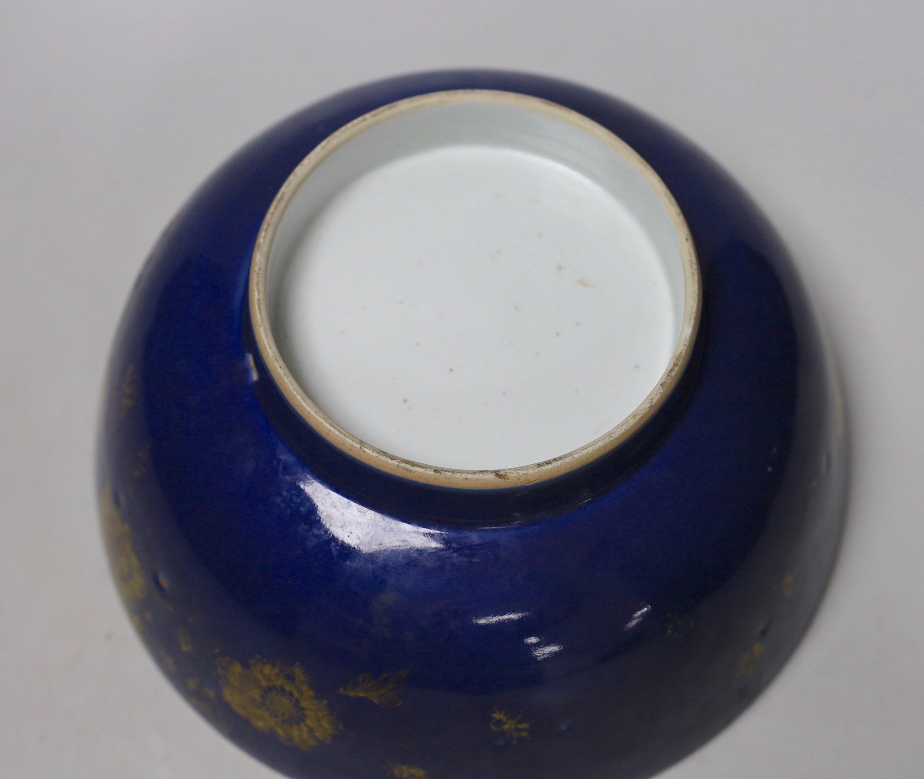 An 18th century Chinese gilt decorated powder blue glazed bowl, 26cm diameter